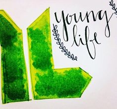 the young life logo is painted on a piece of paper with green paint and black lettering