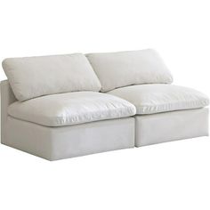 a white couch with two pillows on it