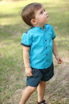 I wanted this baby and toddler boy outfit both classy and ethnic with this mix of plain cotton lawn and footprint design fabric.  The 'footprint' set exists in blue or beige if you like a less flashy style.  The short-sleeved shirt has mandarin colar and is covered with footprint design fabric at the top of the back and end of the sleeves. It is in pure cotton lawn.  The shorts is made of printed cotton with false straight pockets at the back. Washing notes: Machine wash possible (cold or 30o ma Cotton Matching Outfits For Summer, Summer Matching Cotton Outfit Sets, Summer Cotton Matching Outfits Sets, Family Matching Fitted Sets For Summer, Summer Family Matching Fitted Sets, Spring Family Matching Fitted Sets, Fitted Family Matching Sets For Summer, Family Matching Cotton Sets With Short Sleeves, Fitted Cotton Sets For Summer