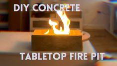 a fire pit sitting on top of a table next to a white chair with the words diy concrete tabletop fire pit