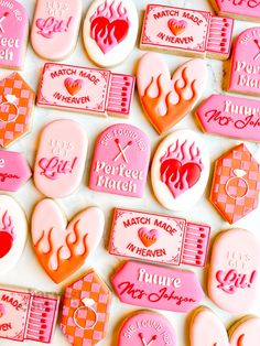 pink and orange cookies with different designs on them