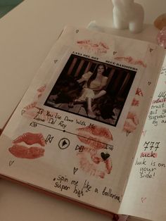 an open book with pictures and writing on it