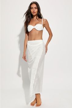 Throw on your best bikini and the 4th & Reckless Arles Ivory Pointelle Side-Tie Sarong Swim Cover-Up for a look that's certain to stun! Sheer, stretchy knit (with a chic, pointelle-inspired pattern throughout) shapes this sultry, sunny sarong that has a flattering fit, with a wrap-style design that ties at the side. Overlapping silhouette continues down to a maxi hem. Fit: This garment fits true to size. Length: Mid-calf length. Size medium Waist: Loosely Fitted. Hip: Loosely Fitted. Fabric: Fab Elegant Bandeau Swimwear For Beach Season, Elegant Bandeau Swimwear For Beach, Elegant Strapless Swimwear For Beach, Beachy White Cover-up For Party, Beachy White Party Cover-up, Elegant Tie-side Swimwear For Beach Season, Elegant White Swimwear For Vacation, Elegant White Bandeau Swimwear, Elegant Swimwear For Vacation