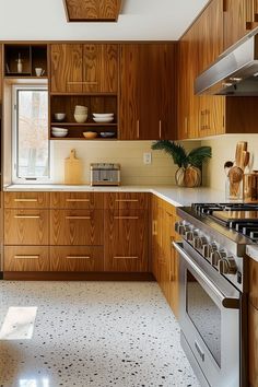 a kitchen with wooden cabinets and stainless steel appliances