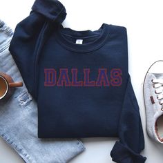 "Dallas Sweatshirt, Dallas Hoodie, Dallas Shirt, Dallas Gift, Dallas Trip, Dallas Vintage, Beautiful Dallas Production Time: 1-3 days (Typically within 2 days) Shipping Time: 2-5 days (Typically 3 days) Product Description: The Gildan UNISEX Sweatshirt (18000) and Hoodie (18500) are crafted from high-quality materials. The Gildan Heavy Blend garment offers an impeccable fit and a plush, comfortable feel.  Care Instructions: - Machine wash: warm (maximum 40C or 105F) - Use non-chlorine bleach as needed - Tumble dry: medium heat - Do not iron - Do not dry clean We care about you and the environment: - Our print chemicals are certified by \"REACH\" and \"Oeko-Tex® Standard 100 Class I\". (Oeko-Tex Standard 100 is a worldwide certification for textiles such as yarns, fabrics, buttons, linens, Navy Cotton College Sweatshirt, Navy Cotton Sweatshirt For College, Cotton Crew Neck Hoodie For College, Navy Cotton Collegiate Sweatshirt, Cotton Fan Apparel Sweatshirt With Text Print, Navy Long Sleeve Hoodie With Letter Print, Team Spirit Long Sleeve Cotton Sweatshirt, Cotton Team Spirit Sweatshirt With Lettering, Fan Apparel Long Sleeve Sweatshirt With Text Print