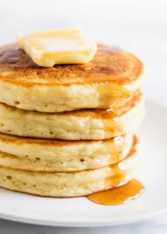 stack of pancakes with butter and syrup on top