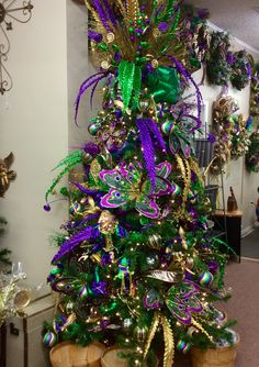 a christmas tree with purple and green decorations