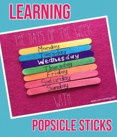 the days of the week popsicle sticks are arranged on top of a pink piece of paper