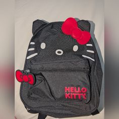 This Is A Hello Kitty Mini Nylon Backpack In The Color Black. Brand New With Tags But Some Color Fading From The Red Hello Kitty Logo On The Front. Comes From A Smoke-Free Home. Measures Approximately 10" X 8.5" X 3.5" Hello Kitty Logo, Red Hello Kitty, Hello Kitty Backpack, Kitty Backpack, The Color Black, Red Backpack, Black Backpack, Black Color, Hello Kitty