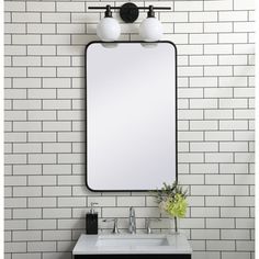 a bathroom sink with a mirror above it next to a white tiled wall and floor