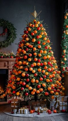 a christmas tree with oranges on it and presents under the tree next to it