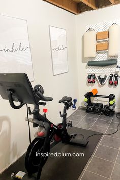 there is a bike and exercise equipment in the room