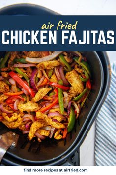 chicken fajitas with peppers and onions in a skillet on a white table