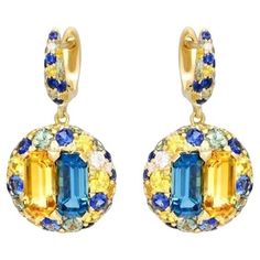 Earrings Yellow 18 K Gold (Matching Ring Available) Weight 9,32 gramm Diamond 16-Round-0.31ct-3 / 5A Topaz 2- 3,54 ct Citrine 2- Square-2,6 ct 2 / 1A Green Sapphire-32-1,54ct Sapphire Blue 32-Circle-1.77ct T (3) / 2A Yellow Sapphire With a heritage of ancient fine Swiss jewelry traditions, NATKINA is a Geneva based jewellery brand, which creates modern jewellery masterpieces suitable for every day life. It is our honour to create fine jewelry, and it’s for that reason that we choose to only work with high-quality, enduring materials that can almost immediately turn into family heirlooms. From our selection of precious metals set with genuine precious stones, you can rest assured that NATKINA is jewelry for your everyday life, forever. Matching Ring, Purple Sapphire, Gold Diamond Earrings, Yellow Citrine, White Gold Earrings, Blue Jewelry, Yellow Sapphire, Sapphire Blue, Gorgeous Jewelry