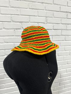 Made to order crochet bucket hat in Jamaican Rasta Colors. Perfect for gifting or vacations! One size, unisex adult hat sizing Casual Yellow Crochet Hat With Short Brim, Casual Yellow Crochet Hat With Wide Brim, Casual Yellow Crochet Hat Hand Knitted, Casual Yellow Handmade Crochet Hat, Casual Yellow Crochet Hat, Casual Yellow Wide Brim Crochet Hat, Yellow Crochet Bucket Hat For Vacation, Adjustable Crochet Vacation Hat, Adjustable Crochet Yarn Hat For Vacation