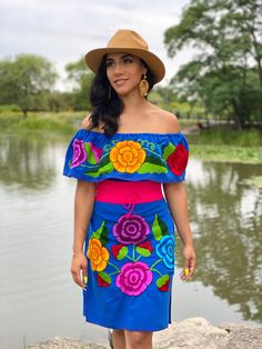 This Beautiful Off the Shoulder Mexican Dress is the perfect Party dress. It's comfortable with elastic around the shoulders and has a tie on the back of the dress for an adjustable fit. Machine Embroidered- hand manipulated. Embroidery will vary on each unique dress. Purchase the belt here: https://www.etsy.com/es/listing/690070823/fajo-artesanal-mexicano-accesorios-para?click_key=04d267b6eaaae94cd493334a5b4fb8a3298c036e%3A690070823&click_sum=7886377f&ref=shop_home_active_3&pro=1&frs=1&sts=1 Mo Mexican Theme Dresses, Mexican Traditional Dress, Frida Kahlo Dress, Boho Dress Plus Size, Traditional Mexican Dress, Peasant Style Dress, Mexican Embroidered Dress, Vibrant Florals, Mexican Party Theme