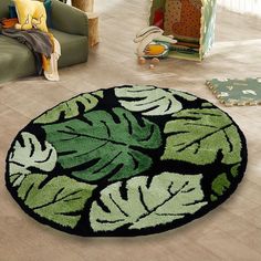 a green and black rug with leaves on it