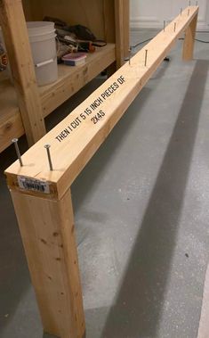 a wooden bench sitting in the middle of a room