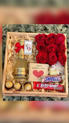 valentine's day gift box with roses, chocolates and champagne in wooden box