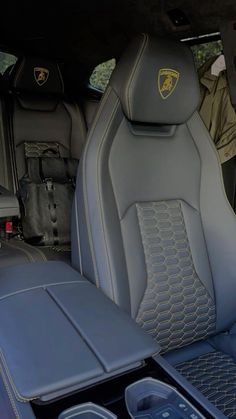 the interior of a sports car with leather seats