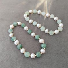 This beautiful bracelet is featuring a elegant combination of type jade rondelles and dainty fresh water pearls. A classic and timeless choice for jade lovers. It can be slipped on and off to add a touch of class to any outfit. Jade bead measure approx. 8mm big, and fresh water pearls measure approx. 6mm big. Each natural freshwater pearl is unique, their size and shape might vary slightly. Made with 14K gold-filled elements. Bracelet measures 6 inches long (15cm) in the pictures. Options of len Elegant Green Pearl Hand-strung Bracelet, Elegant Green Hand-strung Pearl Bracelet, Real Pearl Jewelry, Real Pearl Jewellery, Diy Jewellery Designs, Pearl Bangle, Jade Bracelet, June Birthstone, Real Pearls