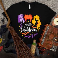 there is a bunch of hockie pocuss on this t - shirt and other halloween items