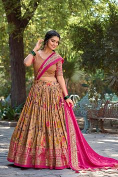 This beautiful lehenga set is crafted from luxurious tussar silk, showcasing an exquisite Kalamkari print enhanced with foil print. The lehenga features a rich Kalamkari design that adds a touch of traditional elegance. Completing the ensemble is a tussar silk dupatta, decorated with Kalamkari and foil prints and finished with elegant tassels. This stunning outfit is perfect for any special occasion, combining traditional charm with modern sophistication.

#TussarSilk
#KalamkariPrint
#FoilPrint
#ElegantLehenga
#TraditionalWear
#DesignerLehenga
#FestiveFashion
#WeddingWear
#EthnicChic
#CulturalElegance
#SilkLehenga
#LehengaCholi
#FashionInspiration
#BridalFashion
#EthnicOutfit Traditional Floral Print Choli, Anarkali Lehenga With Floral Print, Fitted Floral Print Lehenga, Pink Floral Print Lehenga With Traditional Drape, Multicolor Floral Print Lehenga For Festivals, Navratri Floral Print Lehenga With Traditional Drape, Multicolor Floral Print Lehenga For Diwali, Multicolor Floral Lehenga For Diwali, Wedding Lehenga With Kalamkari Print In Traditional Drape