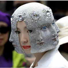 an image of a woman wearing a headdress with many jewels on her head