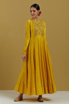 Yellow chanderi anarkali with panelled flare, churidar sleeves, cord detail on neck, hand embroidered yoke in zari and sequin work.
Component: 1
Pattern: Hand Embroidered
Type Of Work: Sequin and Cut dana Work
Neckline: Round
Sleeve Type: Churidar Sleeves
Fabric: Chanderi
Color: Yellow
Other Details: 
Back loop button
Note: The dupatta worn by the model is not for sale
Occasion: Sangeet,Haldi and Mehendi - Aza Fashions Panel Anarkali, Churidar Sleeves, Yellow Anarkali, Silk Anarkali, Indian Dresses Traditional, Kurta With Pants, Anarkali Dress, Designer Dresses Indian, Churidar