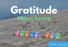 the words thank you written in colorful blocks on top of a wooden surface with text overlay