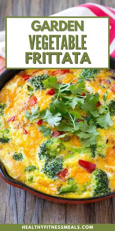 a casserole dish with broccoli, cheese and tomatoes in it on a wooden table