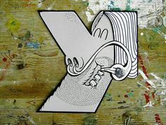 the letter k is made up of paper and scissors