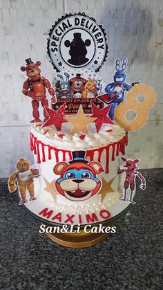 a birthday cake is decorated with cartoon characters and decorations on it's side, along with a mickey mouse topper