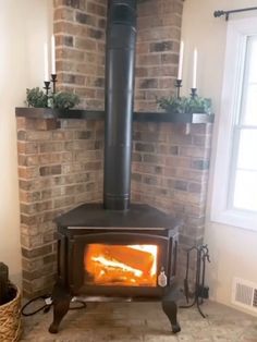 a wood burning stove sitting inside of a living room