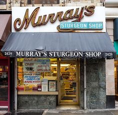 the storefront of a restaurant called murry's surgeon shop