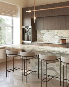 a kitchen with marble counter tops and stools in front of an island that has four barstools on it