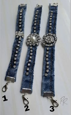 two pairs of blue jeans with silver beads on them