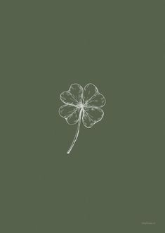 a four leaf clover is shown in the middle of a dark green background with white ink