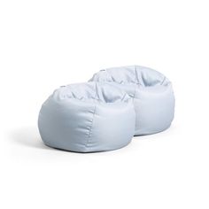 two white bean bags sitting next to each other