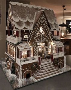 a large gingerbread house with lights on it