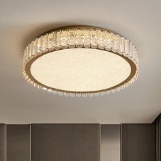 a round light fixture in the middle of a room