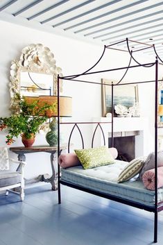 a bedroom with blue floors and white walls