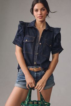 From holy-grail tees and perfectly fitted jeans to laidback dresses, PILCRO is on everyone’s most-wanted-wardrobe list. | Ruffle-Sleeve Denim Buttondown Shirt by Pilcro in Blue, Women's, Size: XS, Cotton at Anthropologie Short Sleeve Denim Shirt Outfit, Denim Shirt Outfit Women, Women Button Down Shirt, Denim Shirt Outfit, Short Sleeve Denim Shirt, Short Sleeve Denim, Wrap Shirt Dress, Fitted Jeans, Casual Glam