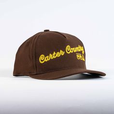 Our Lark trucker hat features a duck canvas crown, chain stitch embroidery and plastic snap closure. Made in the USA Brown Snapback Hat With Embroidered Logo And Flat Brim, Retro Brown Snapback Hat With Curved Brim, Brown Flat Brim Snapback Hat With Embroidered Logo, Brown Cotton Trucker Hat With Embroidered Logo, Brown Trucker Hat With Embroidered Logo, Retro Adjustable Trucker Hat With Embroidered Logo, Brown Embroidered Logo Trucker Hat With Flat Brim, Retro Adjustable Snapback Hat With Embroidered Logo, Retro Brown Cotton Snapback Hat