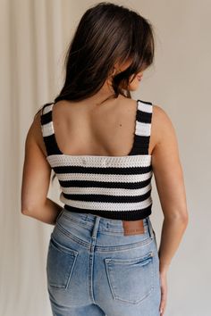 The Kai Black & White Stripe Knit Tank is a perfect blend of timeless style and contemporary flair, designed to make a statement wherever you go. Crafted from a luxurious black and white crochet knit, this tank features a captivating stripe pattern that adds visual interest and texture to your ensemble. The cropped waist silhouette lends a modern touch, perfect for pairing with high-waisted jeans or skirts for a chic look. The rhinestone button-up detailing adds a touch of glamour, elevating the Black And White Crochet, Travel Dress, Jumpsuit Shorts Rompers, Maxi Dresses Casual, Knit Tank, White Crochet, Romper Pants, Knit Tanks, Striped Knit