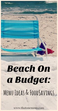 a blue beach chair sitting on top of a sandy beach