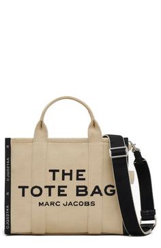 the tote bag by marc jacobs in beige with black and white lettering