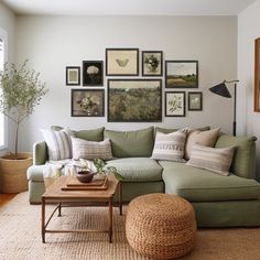 a living room filled with lots of furniture and pictures on the wall above it's coffee table