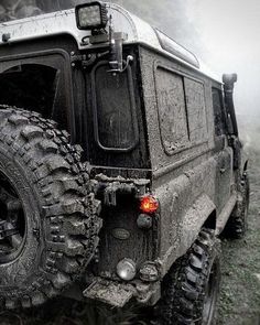 the front end of a black jeep with mud on it