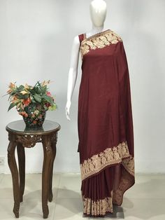 A Marvellous Embroidered Kashmiri Saree which you can wear at any party or a wedding.- - - - - - - - - - - - - - - - - - - - - - - - - - - - - - - - - - - - - - - - Product Details- Condition: Brand New (made to order)- Style: Women Saree Dress- Embroidery: Kashmiri Zari Embroidery- Base Colour: Maroon- Embroidery Colour: Gold- Care Instructions: Dry Clean OnlyF A B R I CSaree: Pure SilkBlouse: Pure SilkF I N I S H- UnstitchedYou can get it stitched locally.- StitchedWant your blouse ready to we Kashmiri Embroidery Saree, Kashmiri Saree, Maroon Embroidery, Kashmiri Embroidery, Saree Women, Crepe Silk Sarees, Women Saree, Zari Embroidery, Traditional Outfit